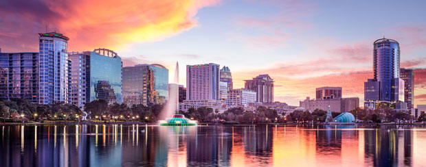 City in background over water at sunset