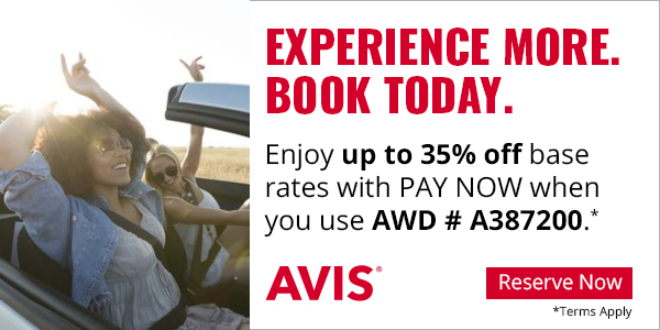 Two women in a convertible car with the top down. Avis car rental with up to 35% off using AWD # A387200